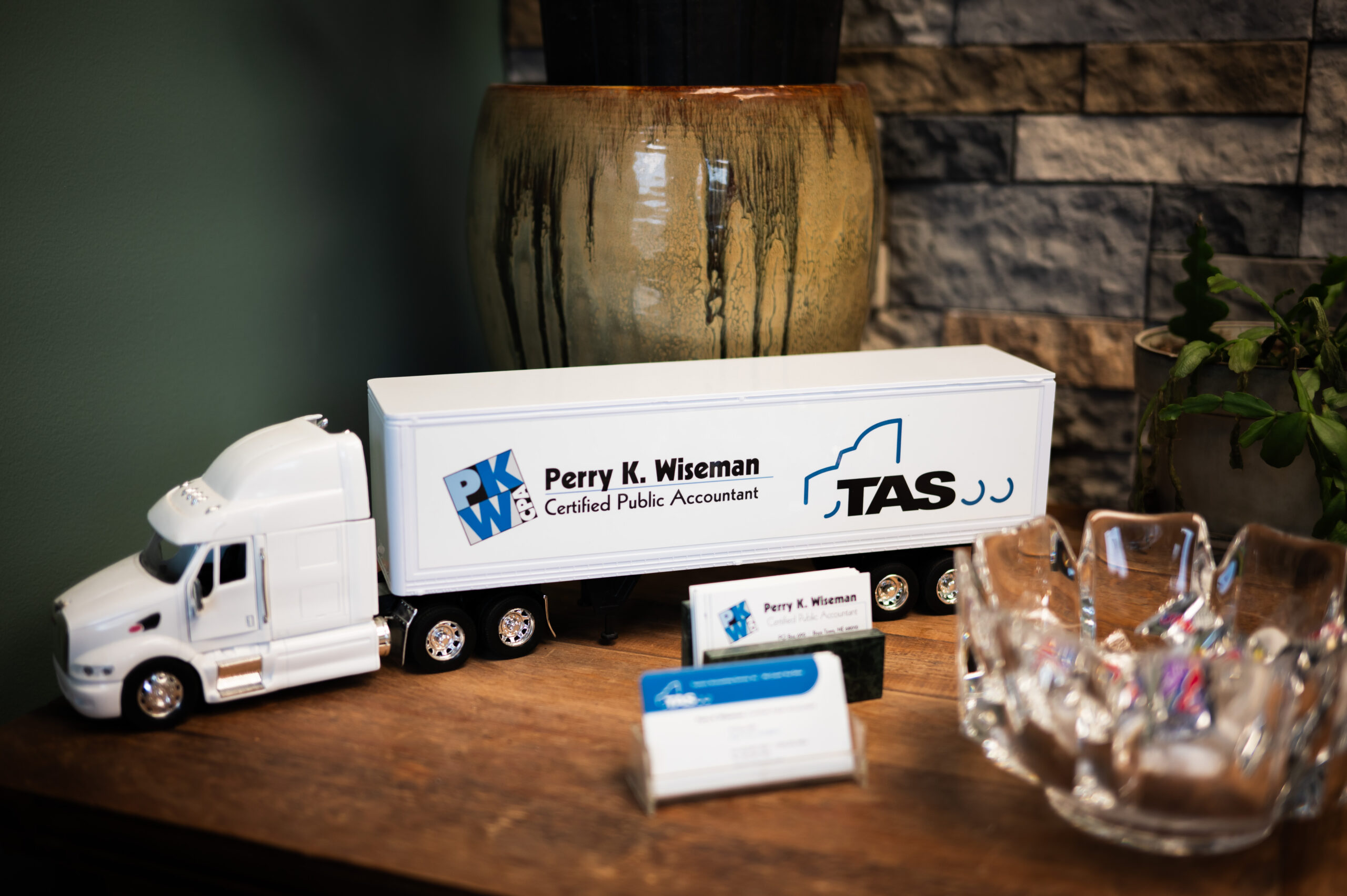 Image of TAS Model Semi-Truck on office reception desk.