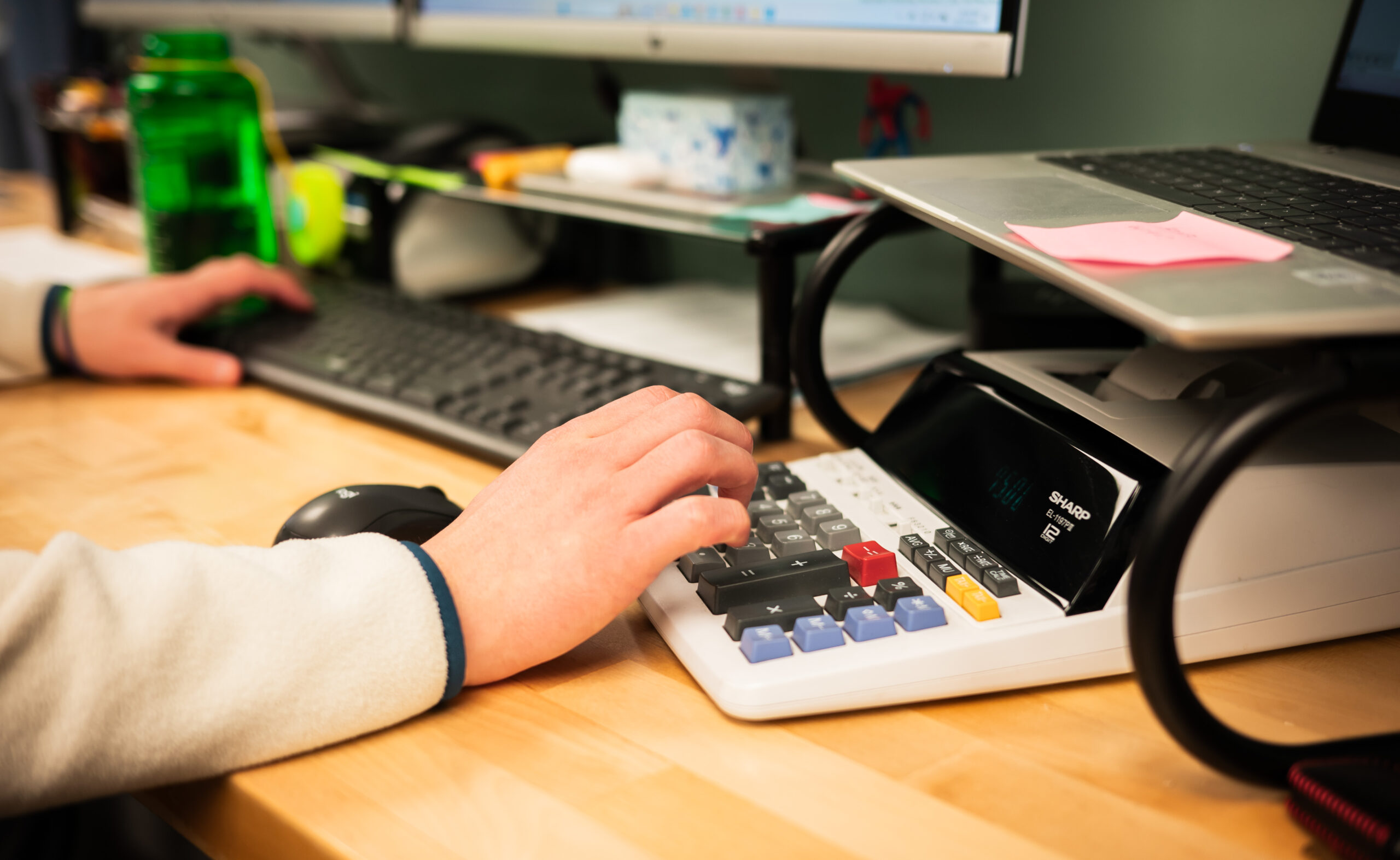 Image of team member making calculations.